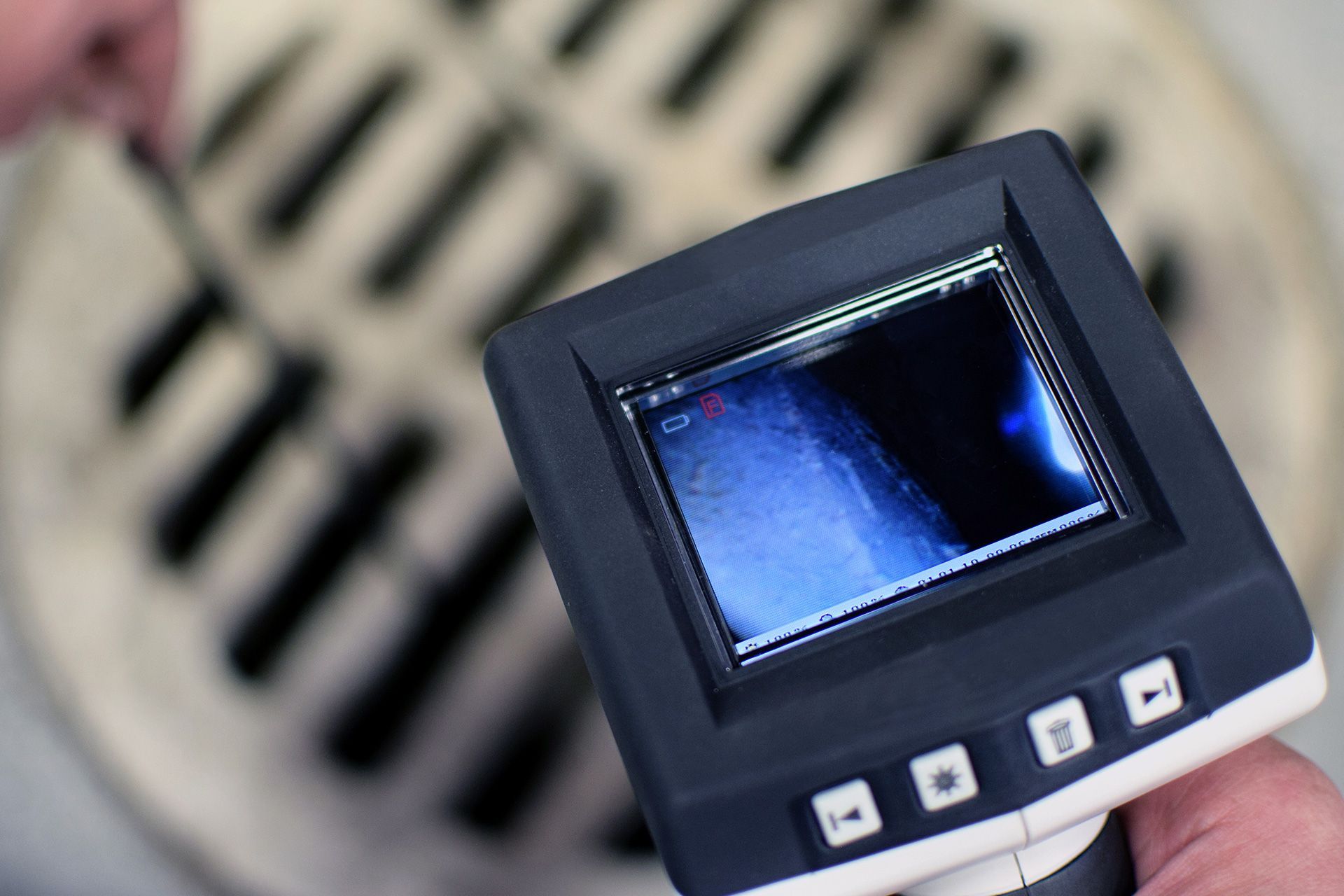 Sewer scope inspection camera inserted into commercial drain line