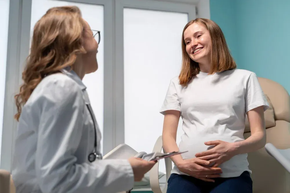 Expecting couple meeting with a fertility specialist at Precision IVF in Dallas