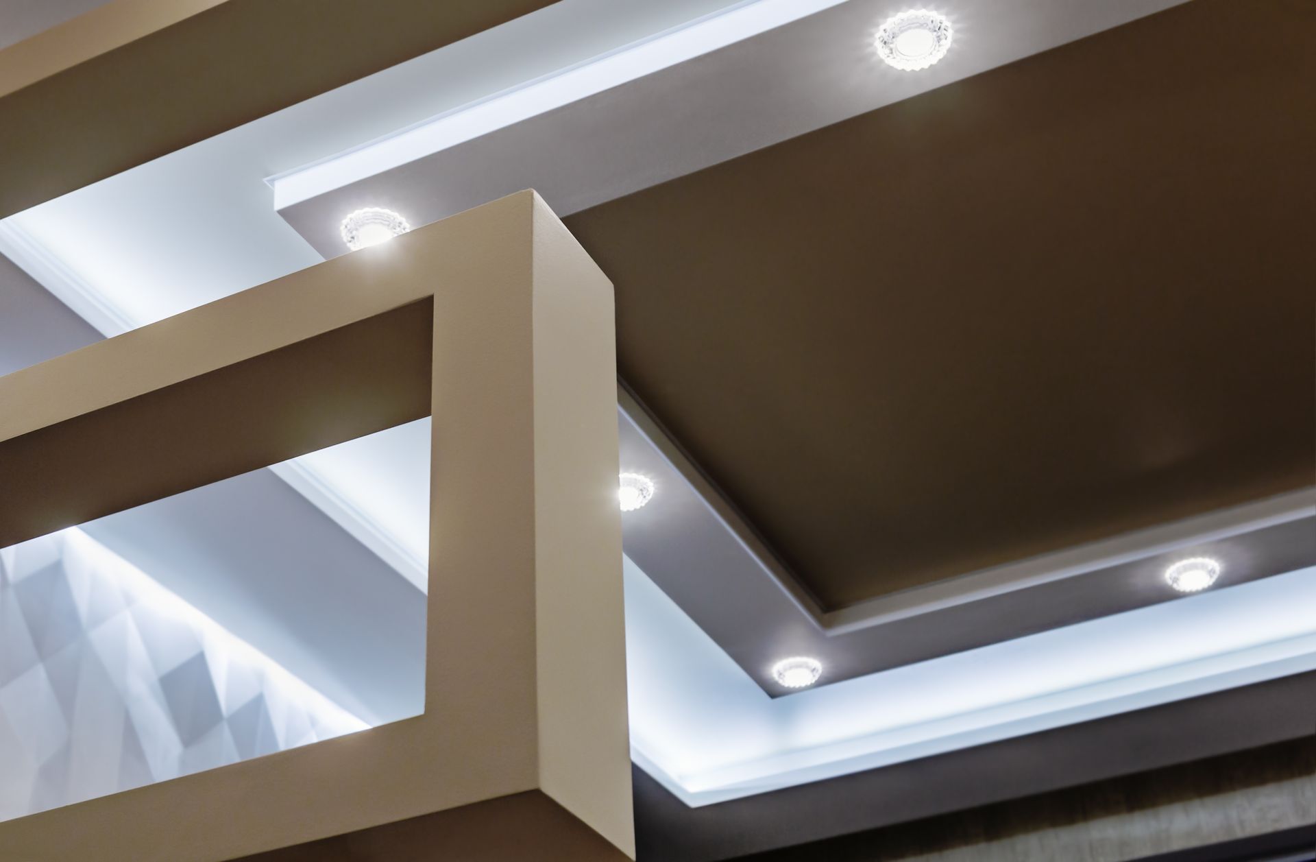 Suspended ceiling construction showcasing LED lighting installation in modern interior design.