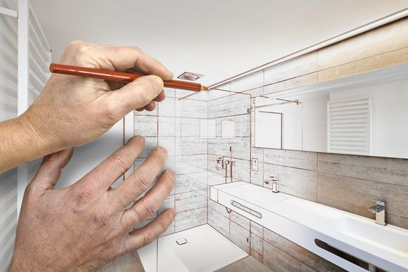 a person is drawing a bathroom with a pencil .
