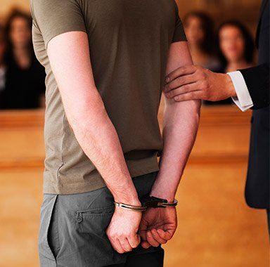 Criminal Law — Handcuffed Man Standing in Courtroom in Pensacola, FL