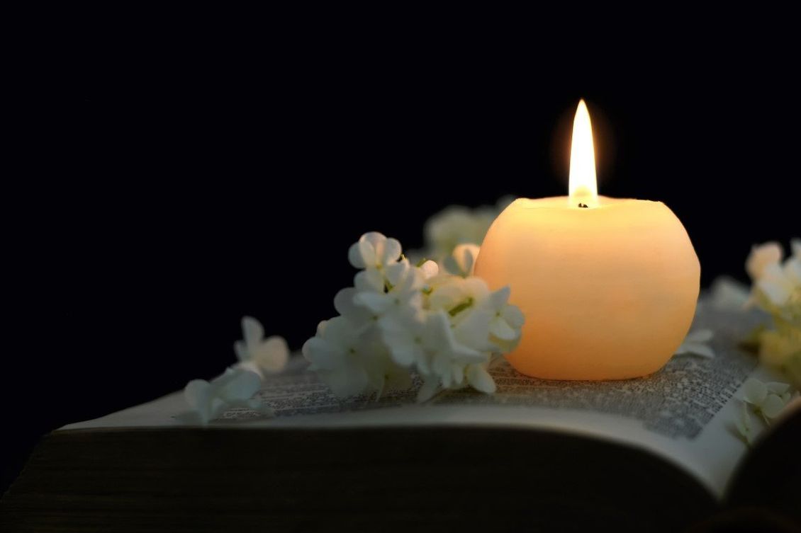 candle and flowers  for funeral rites