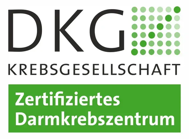 Ein Logo für ein Unternehmen namens DKG Krebsgesellschaft
