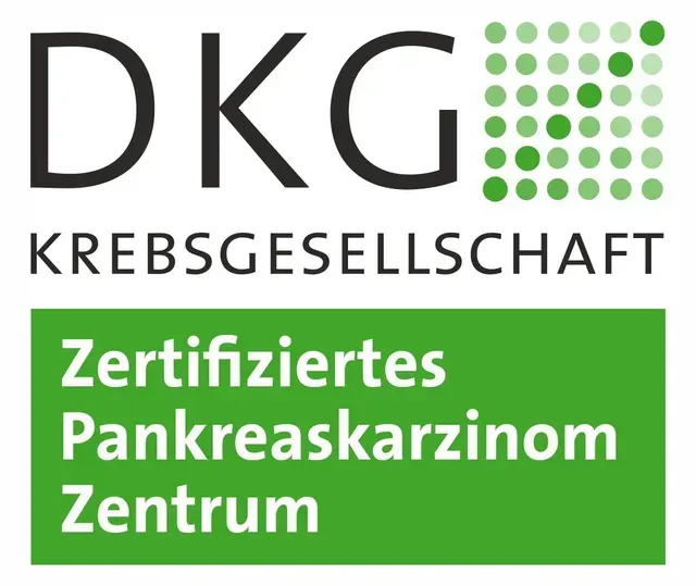 Ein Logo für ein Unternehmen namens DKG Krebsgesellschaft