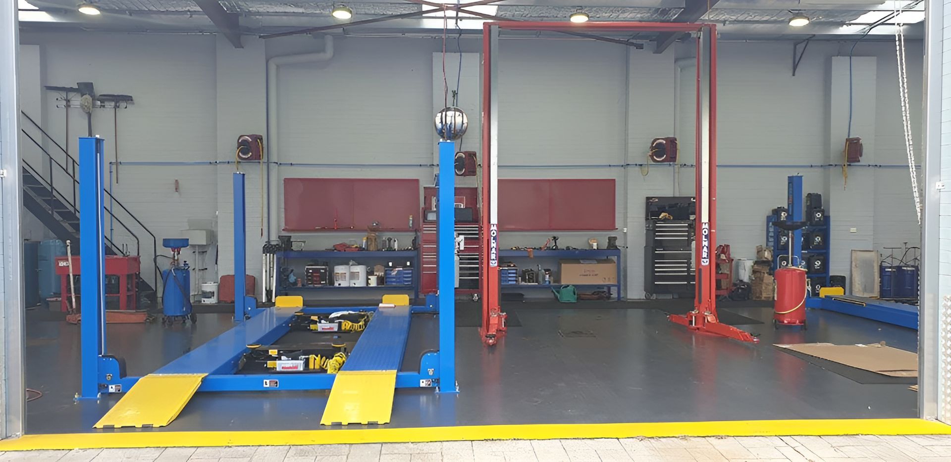 A Garage with A Lot of Lifts in It — AJ Automotive Services Bowral in Bowral, NSW
