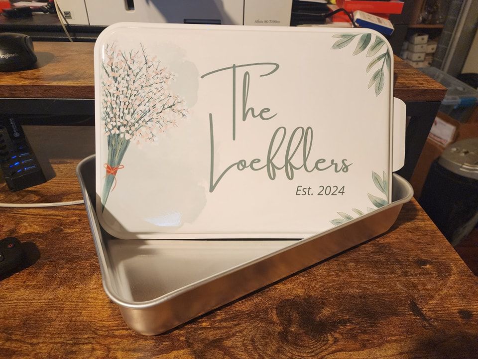 A personalized baking pan with a floral design and 