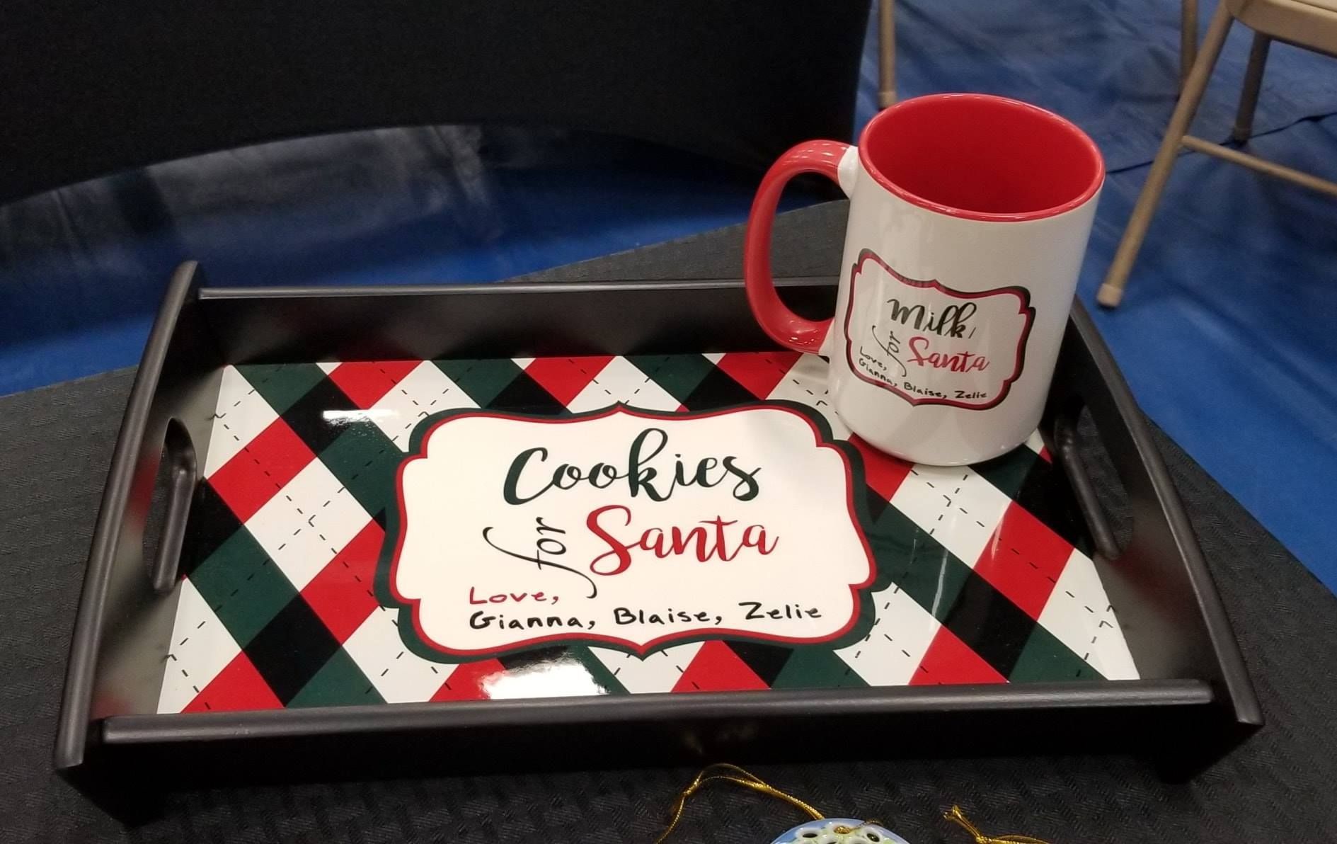 Cookies for Santa tray with a mug on a green, red, and white diamond background.