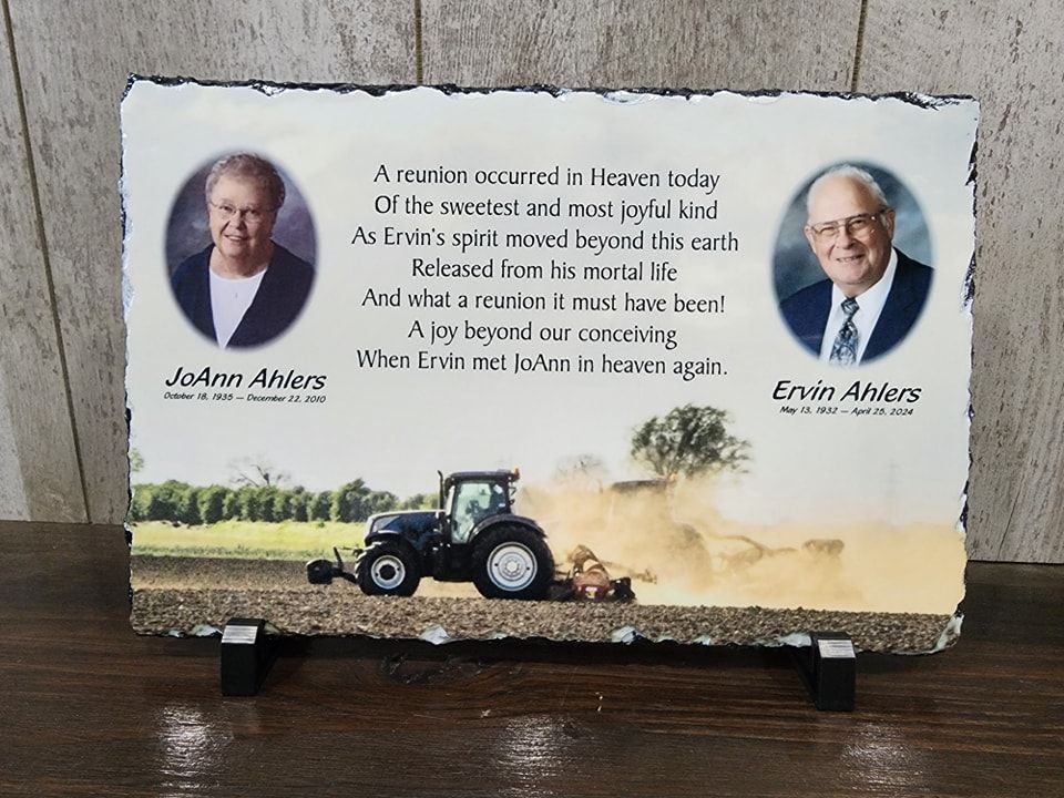 Memorial plaque with photos, poem, and tractor scene; in memory of JoAnn and Ervin Albers.