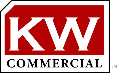 A red and white kw commercial logo on a white background