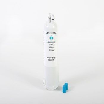 A water filter is sitting on top of a white surface.