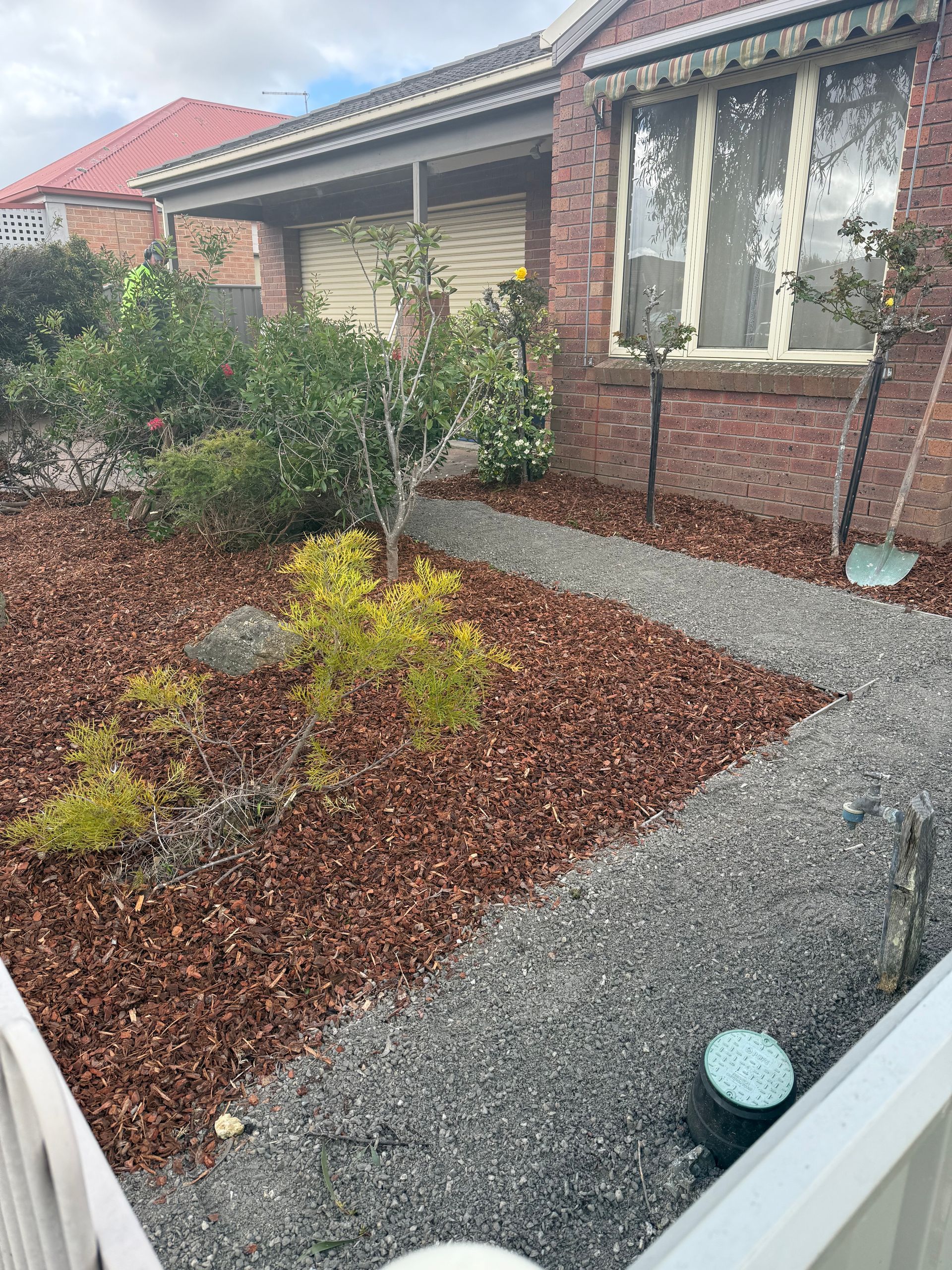 New red mulch and gravel for path