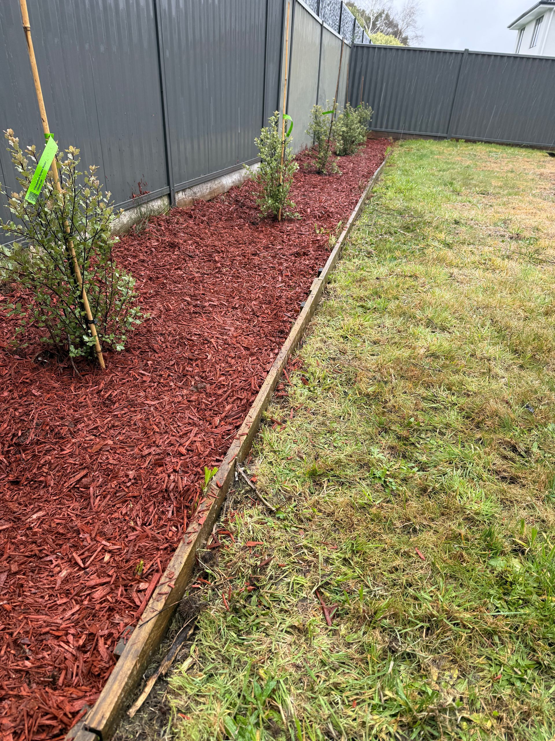 Red mulch garden bed