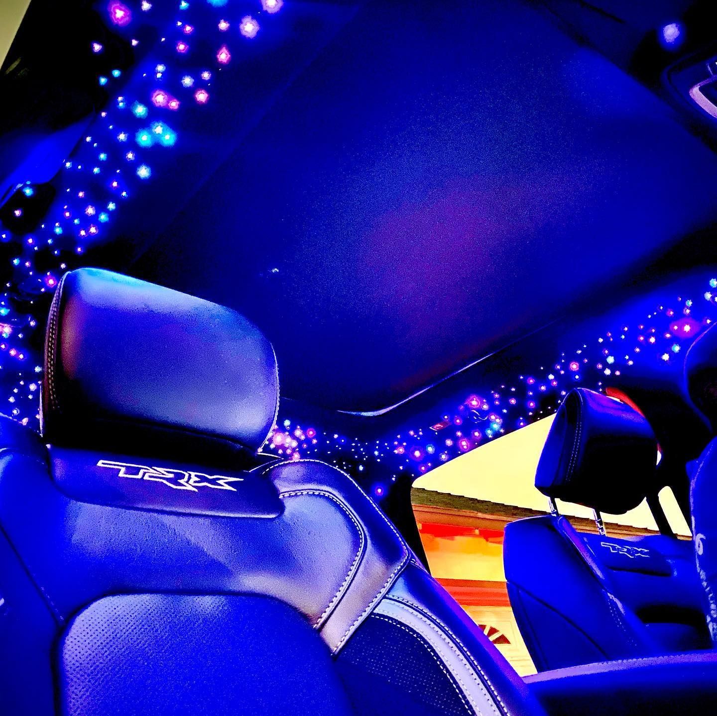 The interior of a car with a blue ceiling