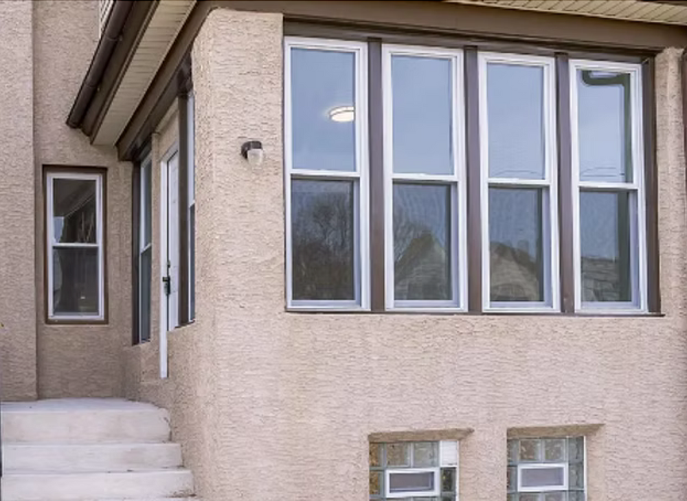 A house with a lot of windows and stairs