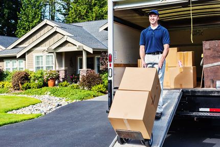 Delivery man unloading cargo — Little Rock, AR — Elite Movers