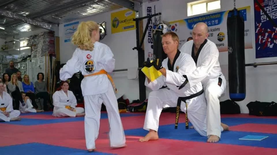 Taekwondo Experts Teaching a Girl a Martial Art — Tae Kwon Do Lessons in Port Stephens