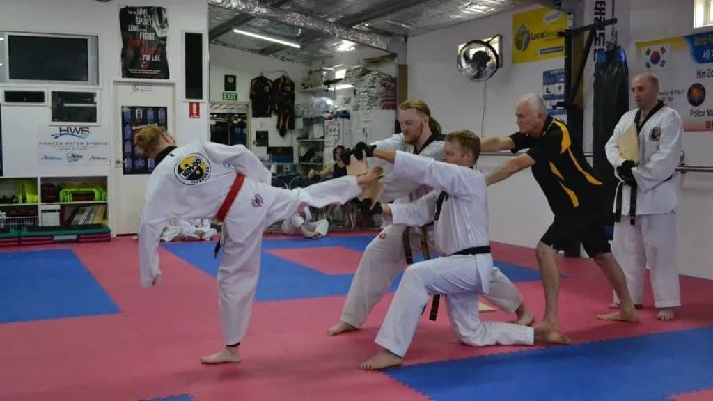 Men Performing Taekwondo Stunt — Tae Kwon Do Lessons in Port Stephens