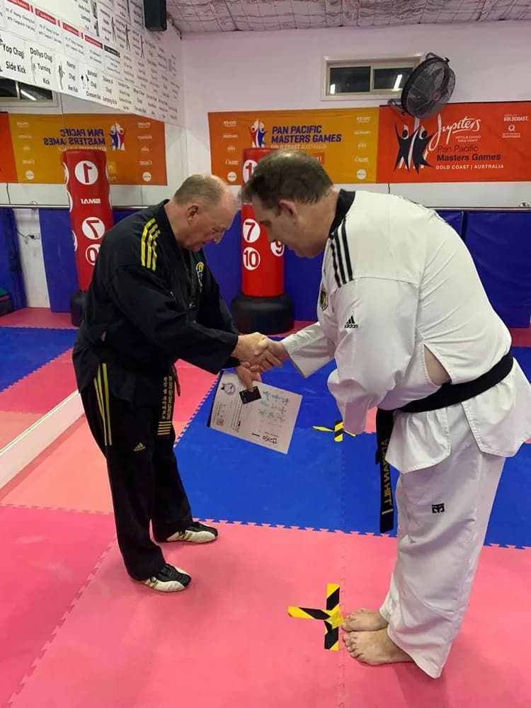 A Black Uniform And White Uniform Certificate Taekwondo — Tae Kwon Do Lessons in Port Stephens