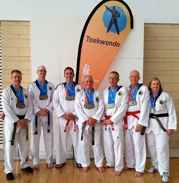 All Older Women And Men White Uniform With Those Medals — Tae Kwon Do Lessons in Port Stephens