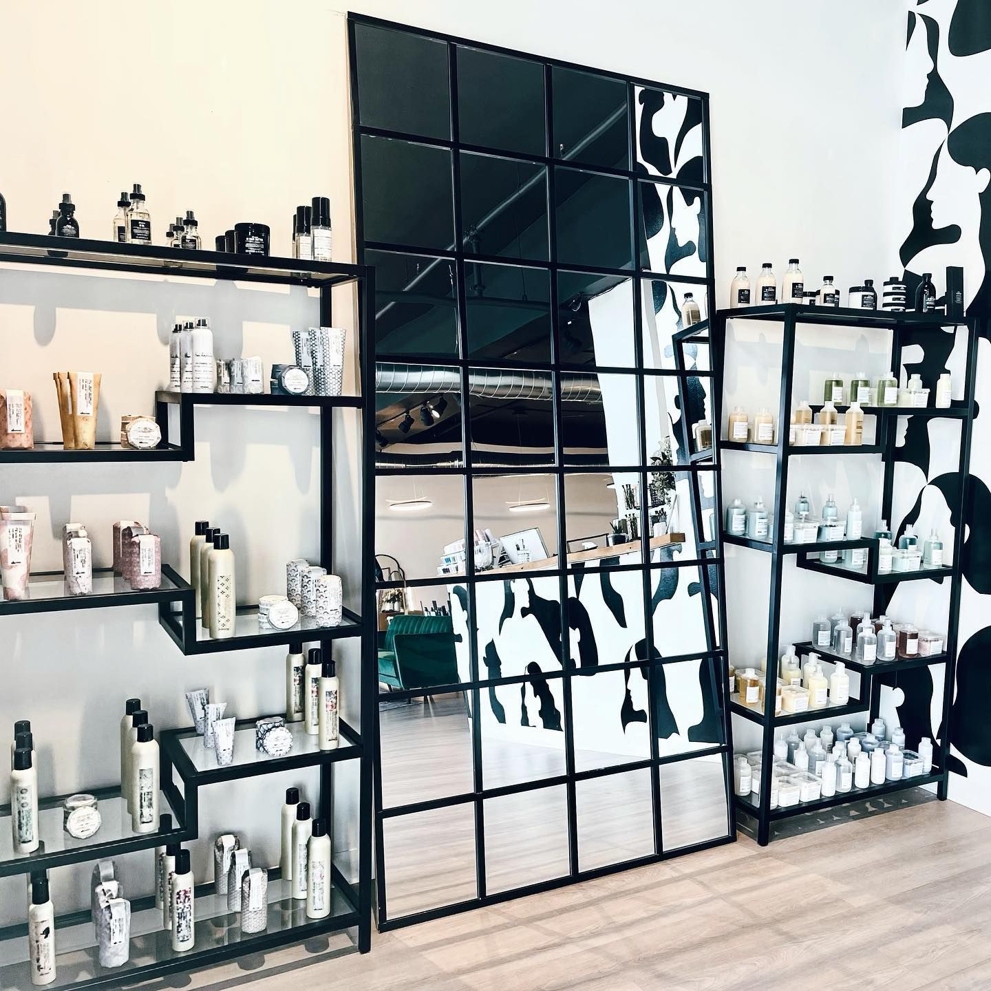 A room filled with shelves and a large mirror.