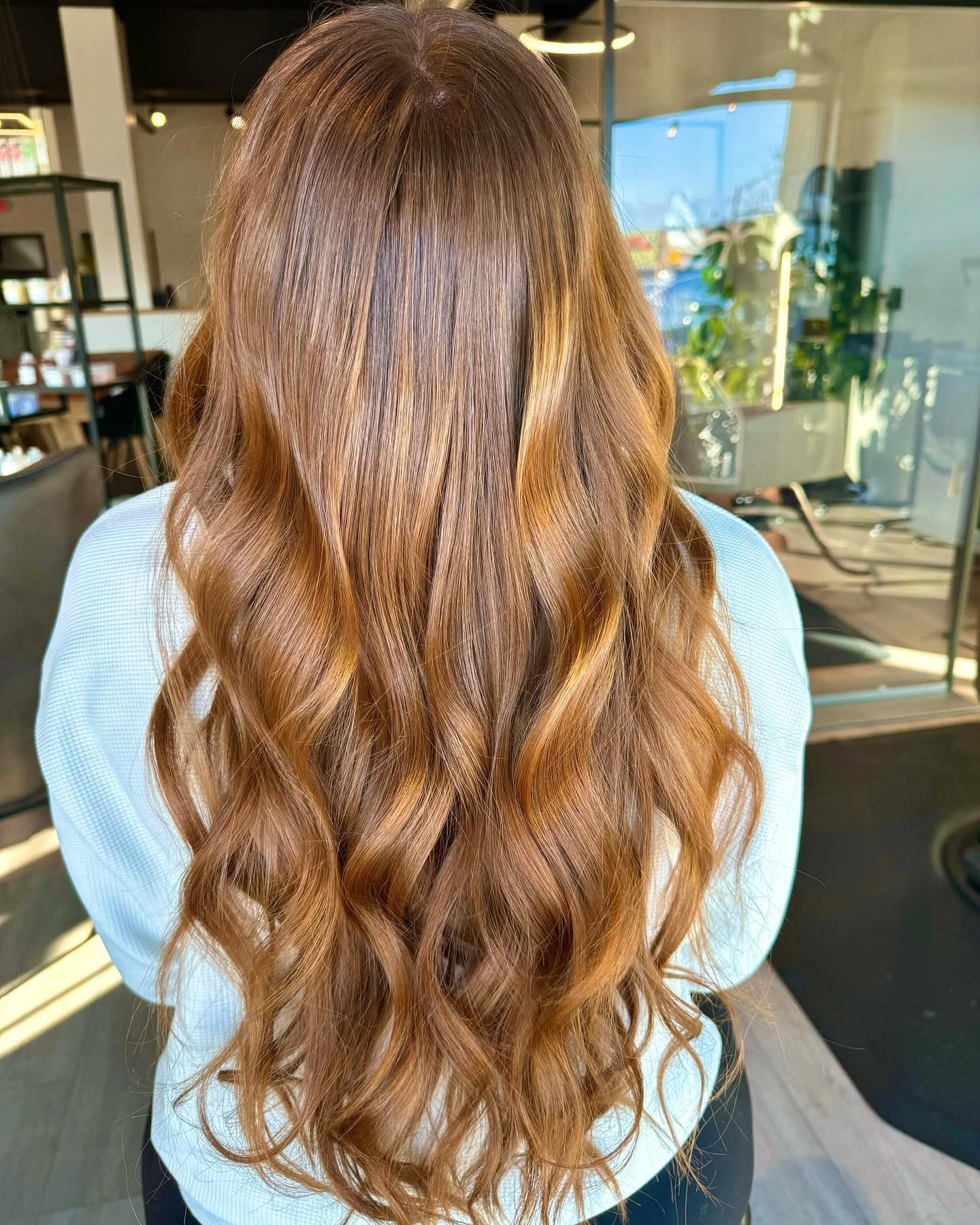 The inside of a moving truck filled with boxes and blankets.