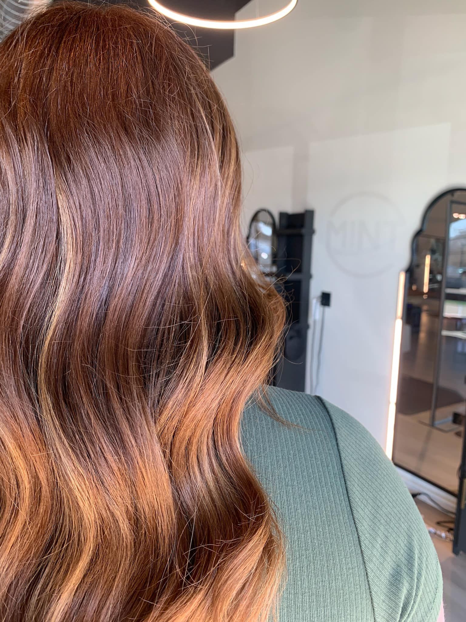 A close up of a woman 's hair in a salon.