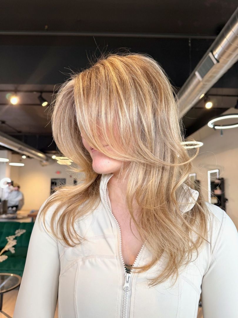 The inside of a moving truck filled with boxes and blankets.