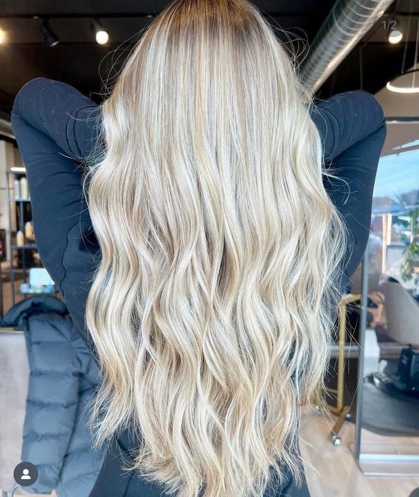 The inside of a moving truck filled with boxes and blankets.