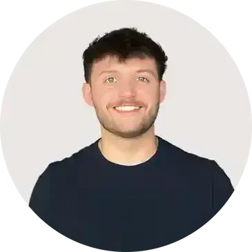 A man with a beard is smiling in a circle.