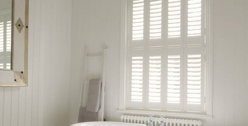 White faux wood shutters