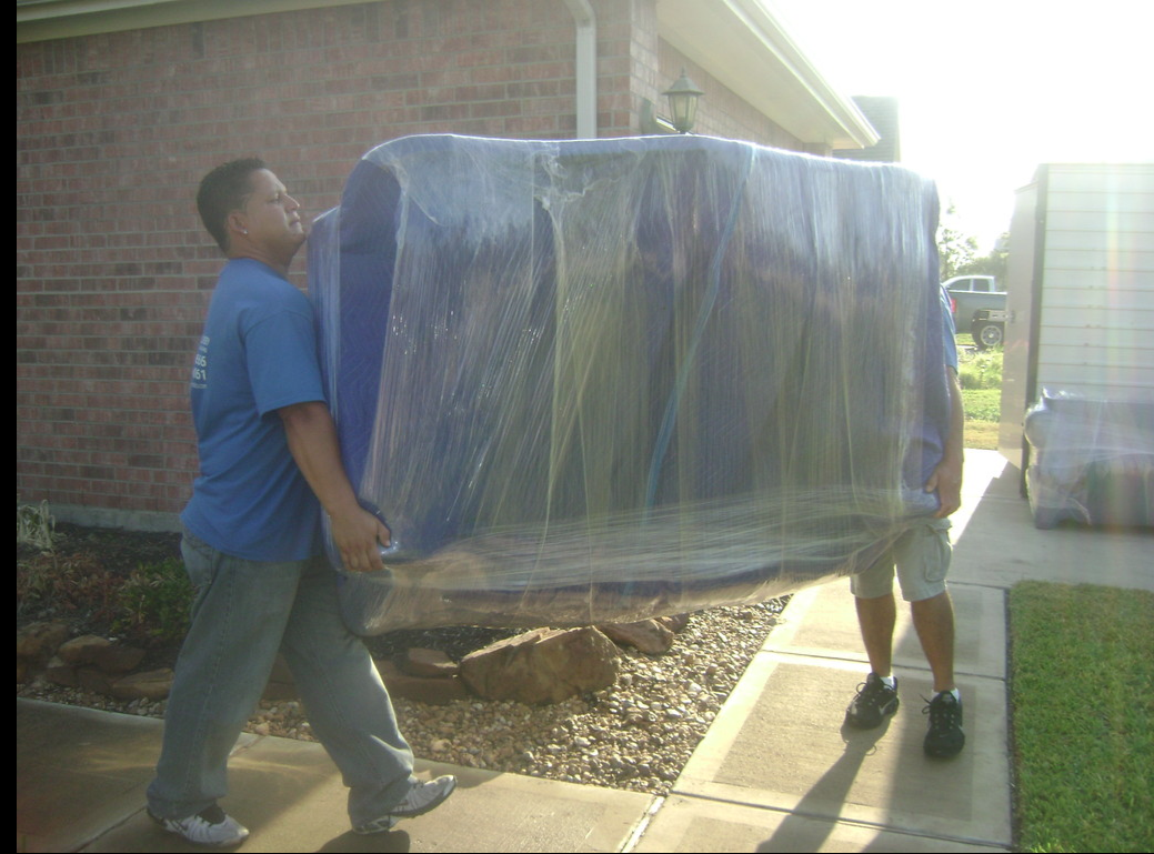 two man carrying sofa