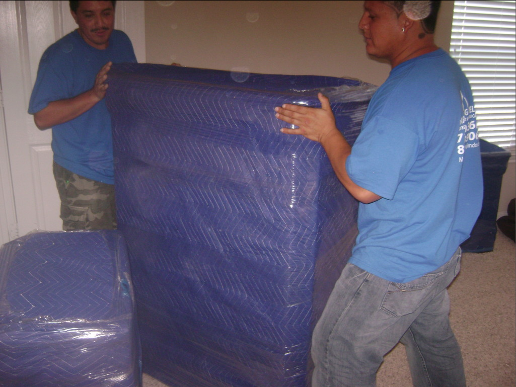 two man carrying sofa