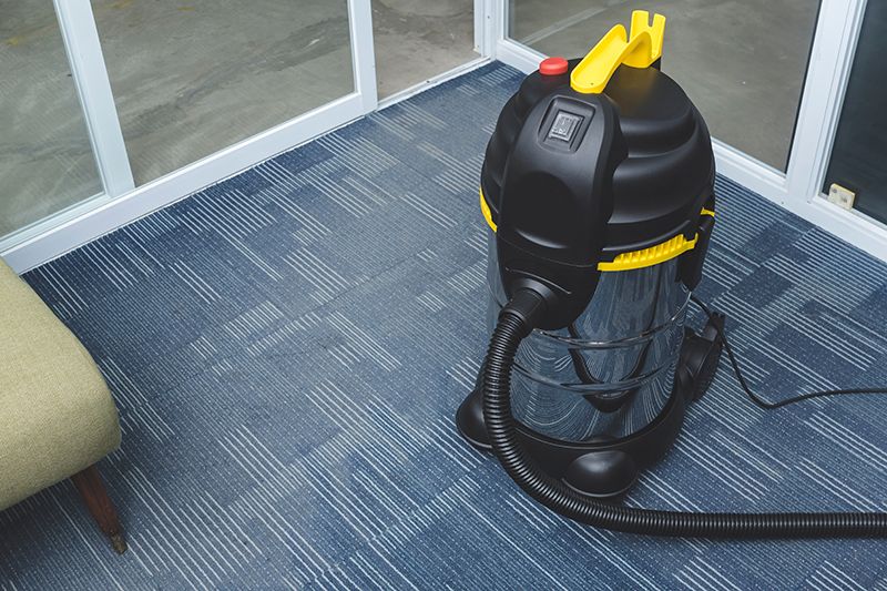 Vacuum Cleaner On Office Carpet