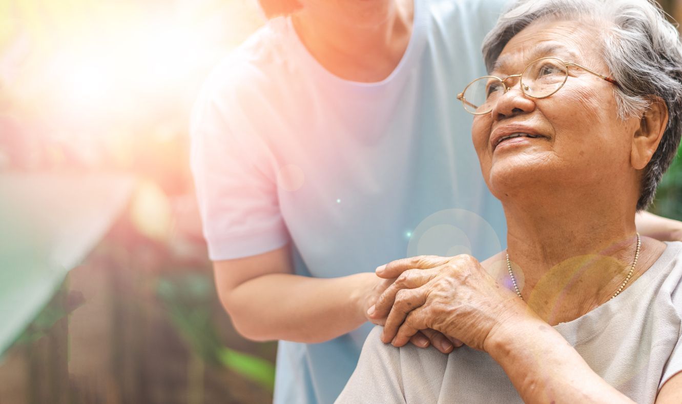 Caregiver, carer hand holding elder hand