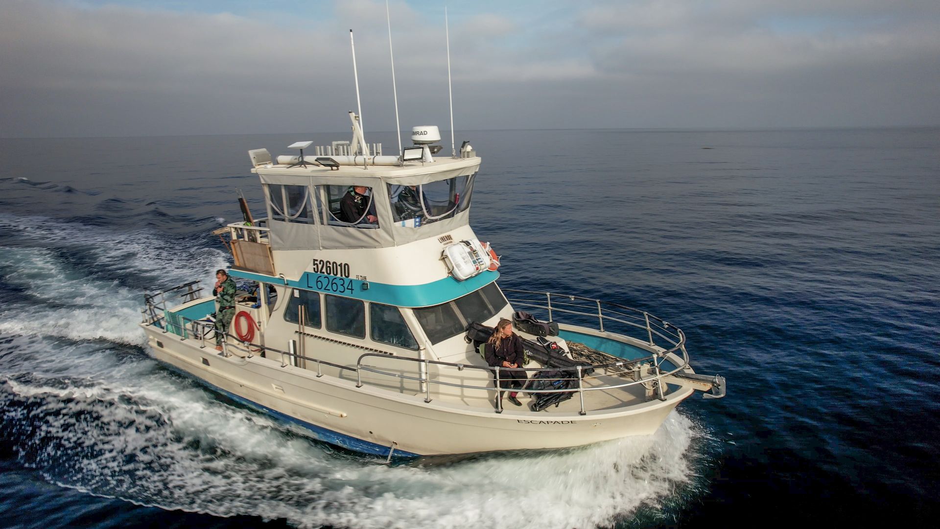 A large boat is floating on top of a large body of water.