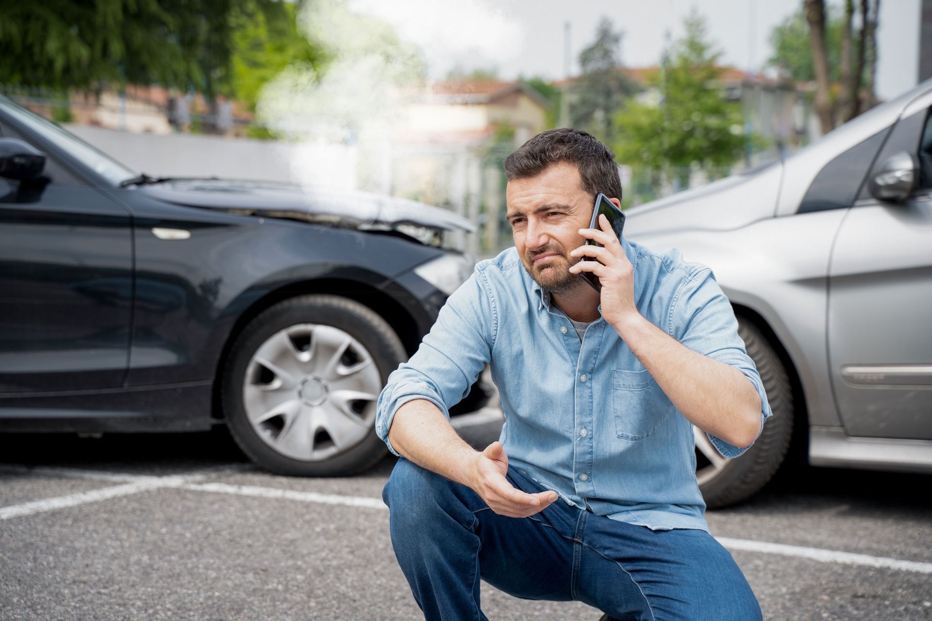 Man in a Car Accident Talking to the Phone