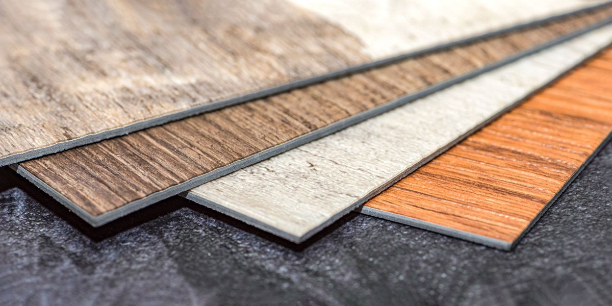 A close up of a stack of different types of wooden flooring.