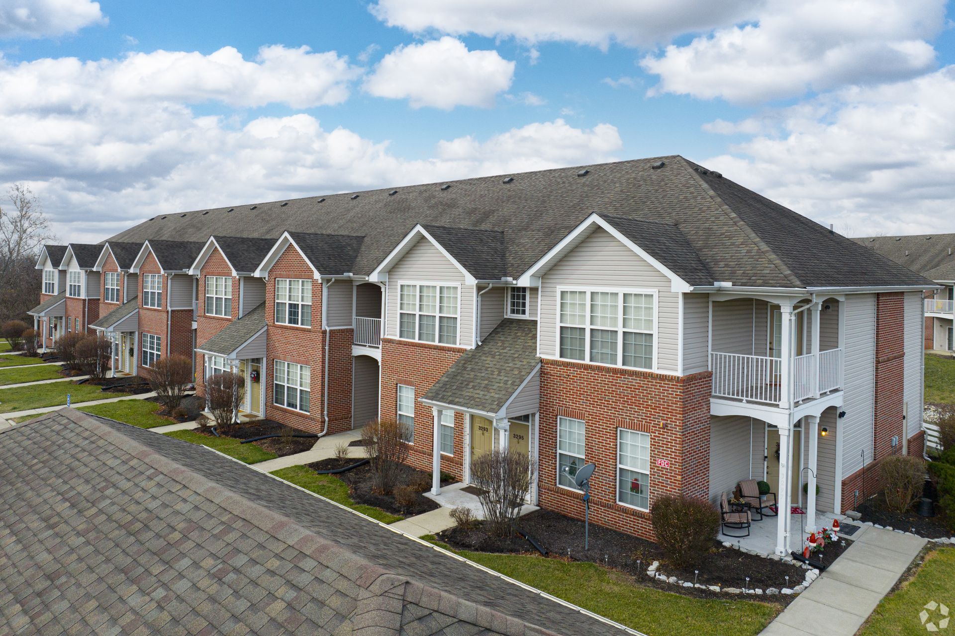 An aerial view of a row of apartment buildings.