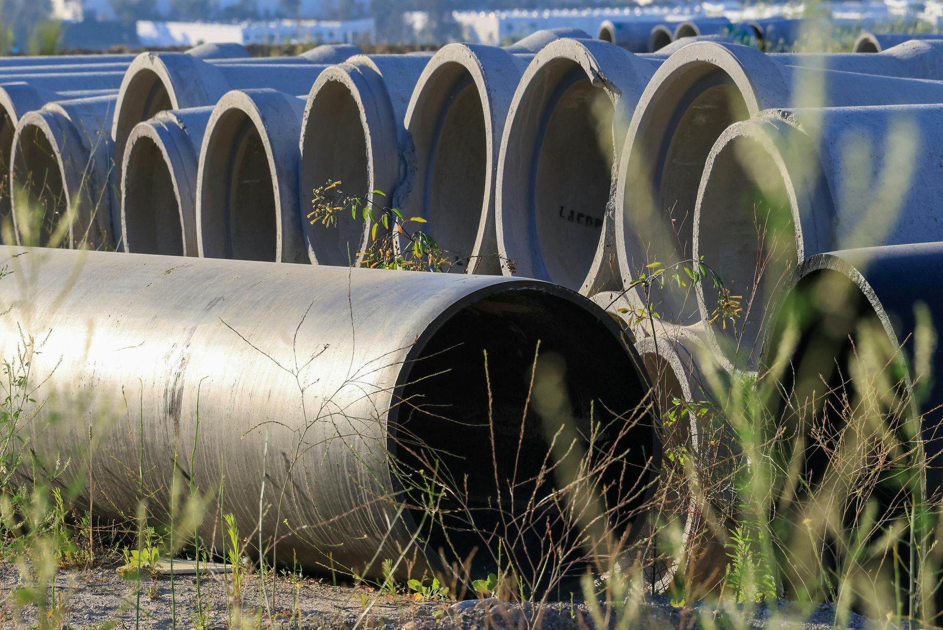 A bunch of pipes are stacked on top of each other