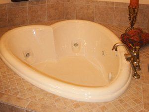 Heart Shape Bathtub — Naples, FL — First Class Plumbing of Florida, Inc.