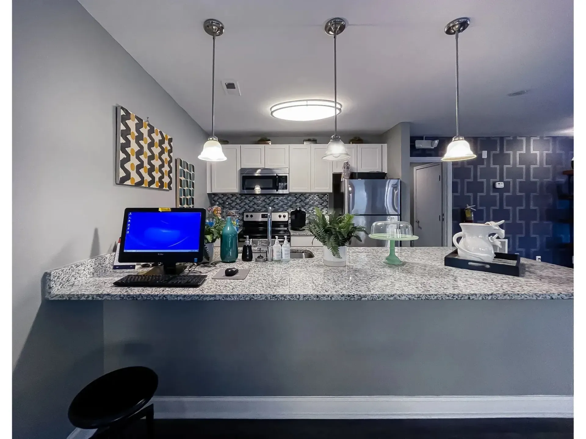 View of a modern kitchen with countertop and appliances