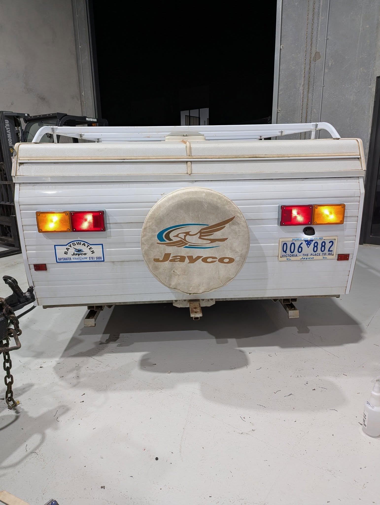 White Jayco Camper Trailer Rear View With Spare Tire — Caravan and Trailer Clinic Geelong in Breakwater, VIC