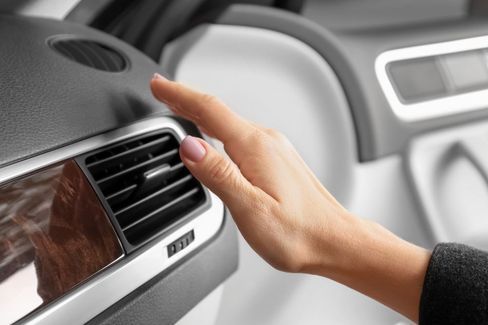 Hand Checking Car Air Vent, Inside a Vehicle — Caravan and Trailer Clinic Geelong in Breakwater, VIC