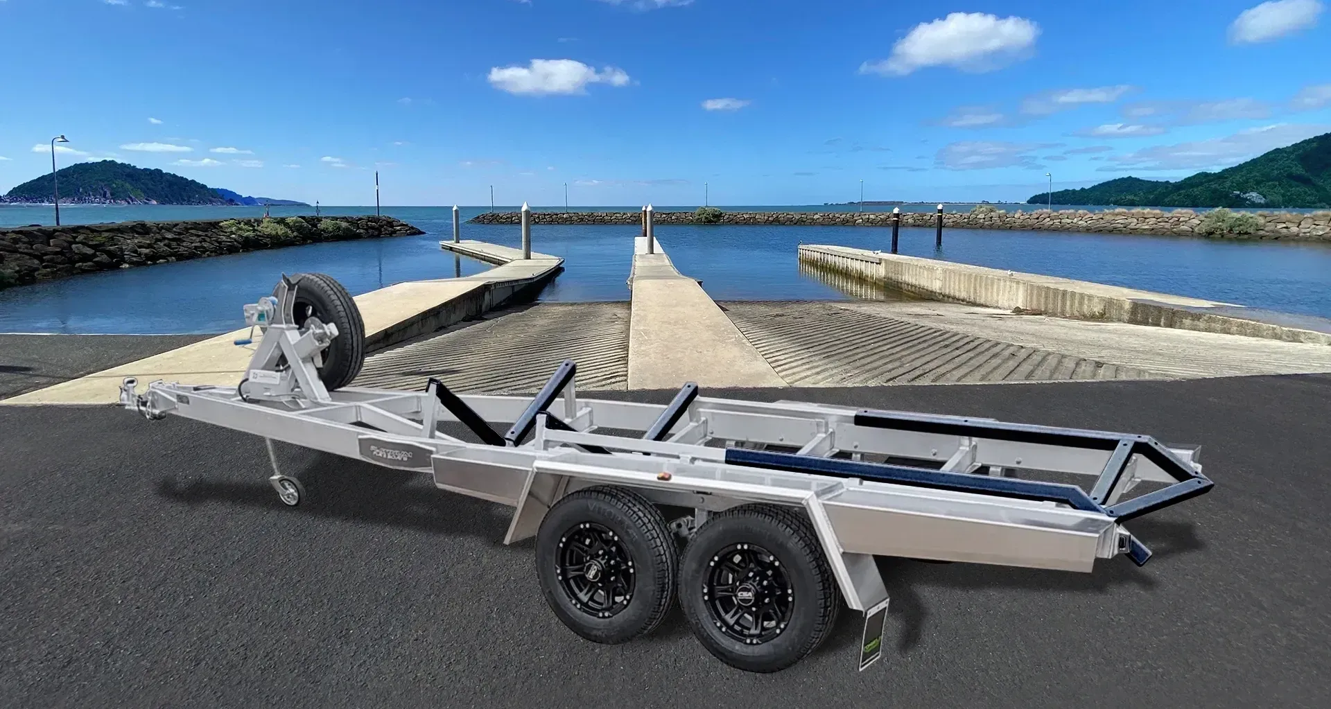 Silver Boat Trailer on Paved Surface, With Boat Ramp — Caravan and Trailer Clinic Geelong in Breakwater, VIC