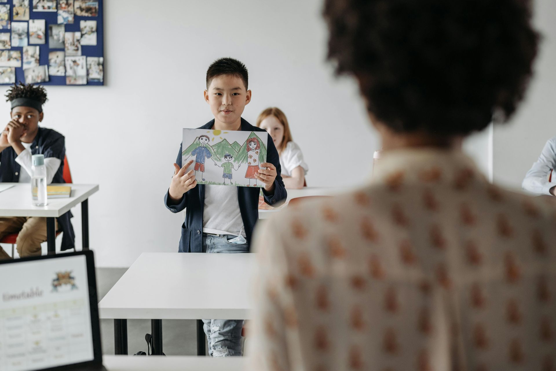 child and tutor preparing for key stage 3 booster