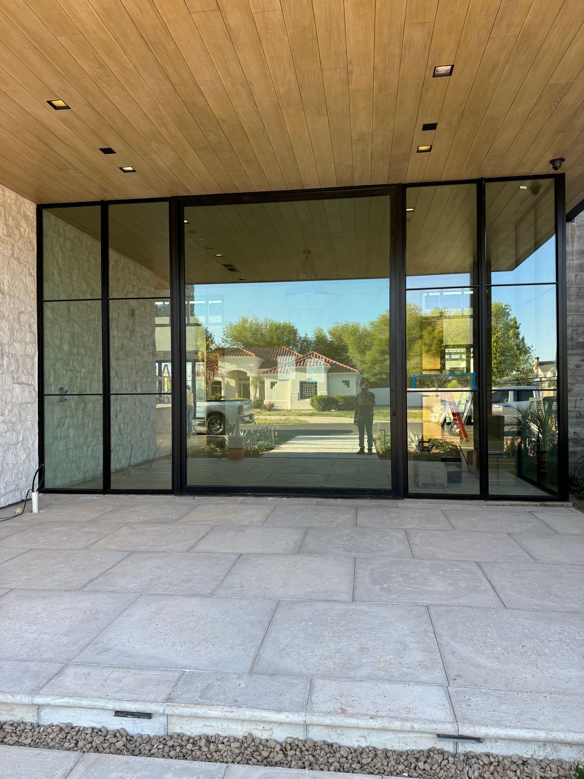 A building with a lot of windows and a wooden ceiling