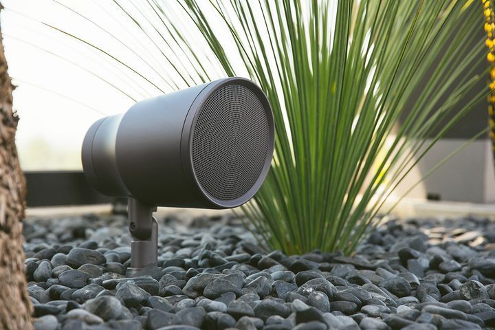 A Speaker is Sitting in a Pile of Rocks Next to a Plant — Complete Audio in Wide Bay, QLD