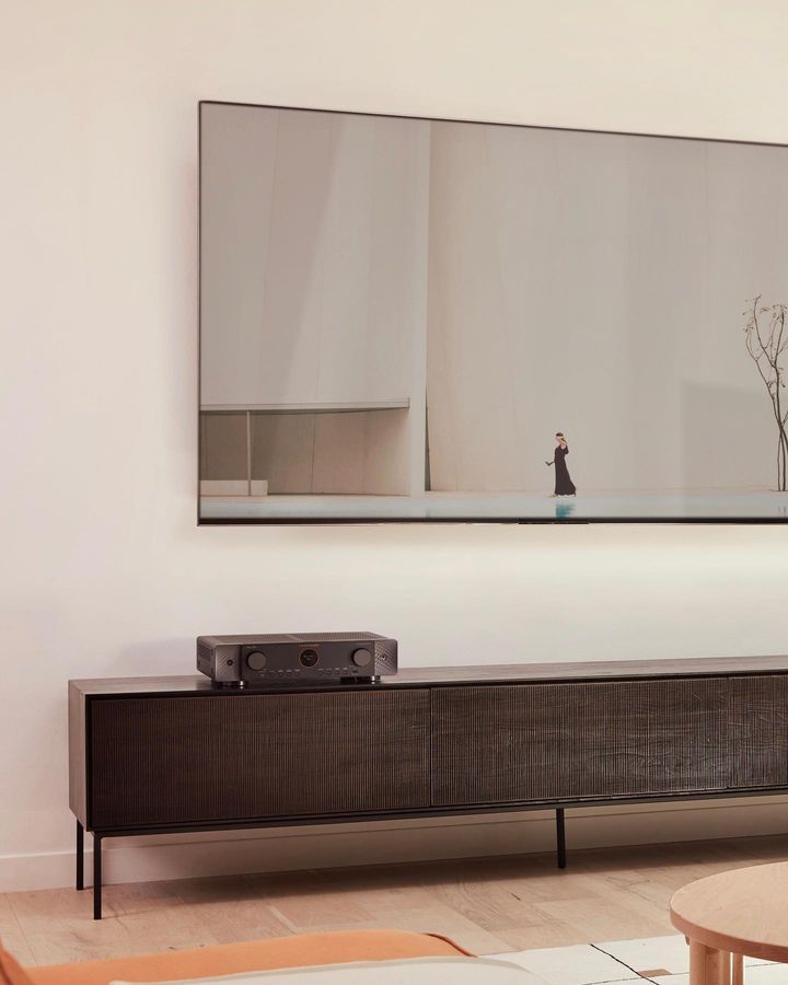 A Living Room With a Large Flat Screen Tv on the Wall — Complete Audio in Maroochydore, QLD