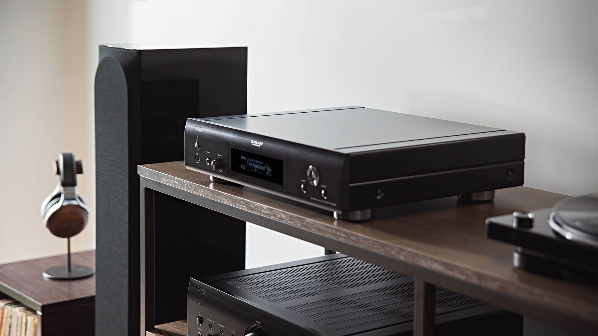 A Black Amplifier is Sitting on Top of a Wooden Shelf — Complete Audio in Maroochydore, QLD