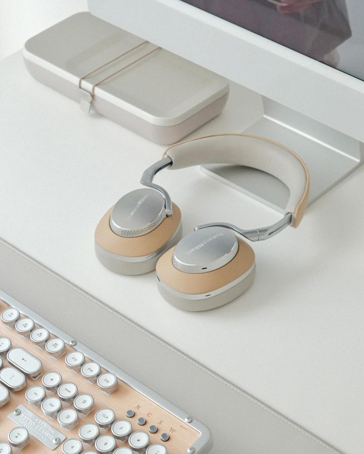 A Pair of Headphones Sitting on a Desk Next to a Keyboard — Complete Audio in Maroochydore, QLD